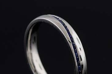 Round Cut Channel Set Sapphire Platinum Wedding Band Ring 3 mm Widehttp://www.orospot.com/product/b1057ven/round-cut-channel-set-sapphire-platinum-wedding-band-ring-3-mm-wide.aspxSKU: B1057VEN$999.00Men's matching wedding band is available SKU #B1058VENClassic, wedding band is made of platinum 950. There are round cut, channel set sapphires ( approx .31ct) securely set all around wedding bend. Ring is 3mm wide, 1.6mm tall and is available in all finger sizes, please contact us for your size preference.