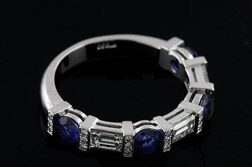 Round Blue Sapphire Baguette And Round Diamonds Bar Pave Set Half Way Wedding Bandhttp://www.orospot.com/product/b2093ven/round-blue-sapphire-baguette-and-round-diamonds-bar-pave-set-half-way-wedding-band.aspxSKU: B2093VEN $2,999.00This unique, half way wedding band is a platinum pieces. Contains four (3.5 mm), natural blue sapphires apprrox .60ct and four baguette diamonds (4 x 2.5 mm, approx .60ct, G-VS quality), bar set as well. There are also small, pave set diamonds (approx. 0.12ct, G-VS quality). Width of the top is 3.5 mm, height 3 mm. Bottom shank is 2.7 mm wide and 1.4 mm tall. This exclusive ring is available in sizes from 4 to 8. Please allow 2-3 weeks to complete the order.