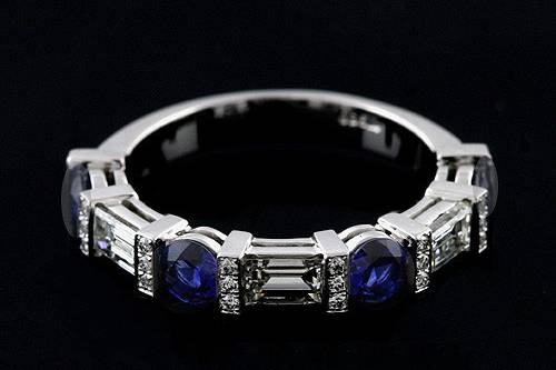 Round Blue Sapphire Baguette And Round Diamonds Bar Pave Set Half Way Wedding Bandhttp://www.orospot.com/product/b2093ven/round-blue-sapphire-baguette-and-round-diamonds-bar-pave-set-half-way-wedding-band.aspxSKU: B2093VEN $2,999.00This unique, half way wedding band is a platinum pieces. Contains four (3.5 mm), natural blue sapphires apprrox .60ct and four baguette diamonds (4 x 2.5 mm, approx .60ct, G-VS quality), bar set as well. There are also small, pave set diamonds (approx. 0.12ct, G-VS quality). Width of the top is 3.5 mm, height 3 mm. Bottom shank is 2.7 mm wide and 1.4 mm tall. This exclusive ring is available in sizes from 4 to 8. Please allow 2-3 weeks to complete the order.