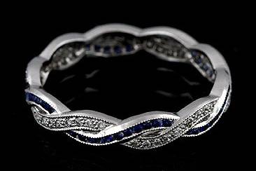Diamond Sapphire Infinity Eternity Wedding Ring Band 18K White Goldhttp://www.orospot.com/product/b546s20mh/diamond-sapphire-infinity-eternity-wedding-ring-band-18k-white-gold.aspxSKU: B546S20MH$1,499.00This beautiful vintage style replica infinity band contains round brilliant diamonds (Approx. .15Cttw) pave set and round blue sapphires (Approx. .23Cttw) set in channel. Diamonds are G-H color and VS2 clarity. This wedding ring is made of solid 18K white gold is high polished with milgrained top. This intertwining band is 3.4 mm wide, 1.5mm tall and is available in all sizes. Please allow 2-3 weeks to complete the order.