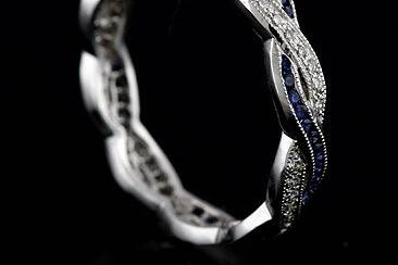 Diamond Sapphire Infinity Eternity Wedding Ring Band 18K White Goldhttp://www.orospot.com/product/b546s20mh/diamond-sapphire-infinity-eternity-wedding-ring-band-18k-white-gold.aspxSKU: B546S20MH$1,499.00This beautiful vintage style replica infinity band contains round brilliant diamonds (Approx. .15Cttw) pave set and round blue sapphires (Approx. .23Cttw) set in channel. Diamonds are G-H color and VS2 clarity. This wedding ring is made of solid 18K white gold is high polished with milgrained top. This intertwining band is 3.4 mm wide, 1.5mm tall and is available in all sizes. Please allow 2-3 weeks to complete the order.