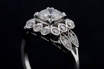 14K White Gold Diamond Edwardian Style Engagement Ringhttp://www.orospot.com/product/rnbprhm/14k-white-gold-diamond-edwardian-style-engagement-ring.aspxSKU: RNBPRHM$4,799.00This beautiful design engagement ring is made of 14K white gold. Contains round cut, GIA certified diamond center stone ( .92cttw, VS1 clarity and E color) and small round cut diamonds (.32cttw) set around center stone. Edwardian style ring with flower accent is available in all sizes, please contact us for more information.