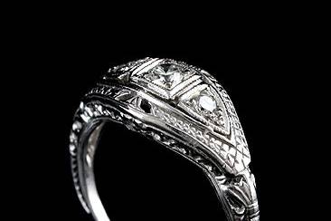 Edwardian Style Diamond 14K White Gold Engagement Filigree Ringhttp://www.orospot.com/product/a11432ama/edwardian-style-diamond-14k-white-gold-engagement-filigree-ring.aspxSKU: A11432AMA$779.00This beautiful Edwardian style engagement ring contains 3 round brilliant diamonds of total weight .25ct, H color and SI2 clarity. Edwardian engagement rings are milgrained, engraved and has filigree finish on the both sides.