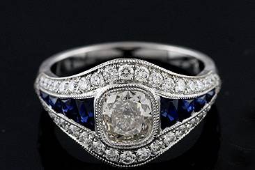 French Cut Sapphire Channel Set And Diamond Platinum Engagement Ring Mountinghttp://www.orospot.com/product/r1051ven/french-cut-sapphire-channel-set-and-diamond-platinum-engagement-ring-mounting.aspxSKU: R1051VEN$2,699.00his beautiful engagement ring is made of platinum 950. Center stone in NOT included ( pictured with .70ct cushion cut diamond) but can be ordered separately from our diamond inventory. Mounting contains eights french cut sapphires channel set (four of them on each side) .45ct, and approx 50 small, round cut diamonds .50ct, G-VS quality pave set. Whole ring is milgrained on the edges and high polished. Diamond ring is 1.9mm wide, 1.5mm tall on the bottom and 5mm tall, 12mm wide on the top. This unique ring can be ordered in all finger sizes, please contact us for your size preference. Please allow 2-3 weeks to complete the order.