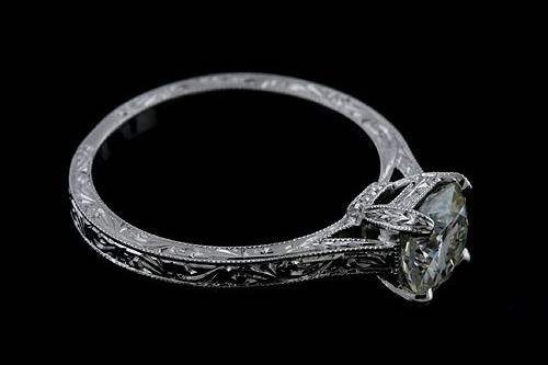 Platinum 950 Hand Engraved Vintage Style Engagement Ring Settinghttp://www.orospot.com/product/r2028ven/platinum-950-hand-engraved-vintage-style-engagement-ring-setting.aspxSKU: R2028VEN$1,099.00This platinum ring was pictured with 6.5 mm cushion shape diamond (stone is not included, but can be ordered from our inventory). Ring can be created to fit any shape/size of the center stone. if you are interested in this mounting and have your own center stone, please contact us and provide the stone shape and measurements, we will create this ring just for your stone. Whole ring is beautifully hand engraved and milgrain on the edges. Width of the shank is 2 mm. Ring is available in all finger sizes, please allow 2-3 weeks to complete the order.