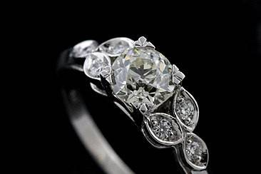 Platinum Old European Cut Diamond Edwardian Style Engagement Ringhttp://www.orospot.com/product/rbcyymh/platinum-old-european-cut-diamond-edwardian-style-engagement-ring.aspxSKU: RBCYYMH$2,849.00This beautiful old European cut diamond engagement ring is made of platinum 950. Contains round cut center stone (. 72cttw, K-L color and SI1 clarity) and six, small, round cut diamonds .10ctttw. Edwardian style reproduction ring with flower accent is available in all sizes, please contact us for your size preference and more information. Please allow 2-3 weeks to complete the order.