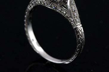 Vintage Style Pave Set Diamond 14k White Gold Engagement Ring Mountinghttp://www.orospot.com/product/r1067ven/vintage-style-pave-set-diamond-14k-white-gold-engagement-ring-mounting.aspxSKU: R1067VEN$1,499.00This design, antique style engagement ring is made of 14k white gold. Mounting is securely micro pave set with 40 round diamonds (.40Cttw, G-SI1 quality) on the setting, on the bridge under the center stone and 3/4 way on the shank. Whole ring is beautifully engraved and miligrained. Prong set, 2ct round diamond center stone is not included but can be ordered separately from our diamond inventory. This mounting can be created with any size or shape of center stone. Diamond is set above the finger approx 7mm, shank on the bottom is 1.8mm wide and 1.1mm tall. This unique, vintage style ring can be ordered in all finger sizes, please contact us for your size preference Please allow 2-3 weeks to complete the order.
