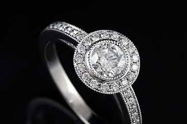 Diamond Micro Pave Milgrain Engagement Ring 14K White Goldhttp://www.orospot.com/product/r1013ven/diamond-micro-pave-milgrain-engagement-ring-14k-white-gold.aspxSKU: R1013VEN$2,299.00This beautiful diamond ring is made of 14k white gold. Contains round cut, bezel set diamond center stone (min. 1/2cttw, G-SI2 quality) and round cut, pave set diamonds (.37cttw, G-VS quality) all around center stone and half way on the shank. Modern style ring is milgrained on the edges and high polish. Available in all sizes, please contact us for your size preference.