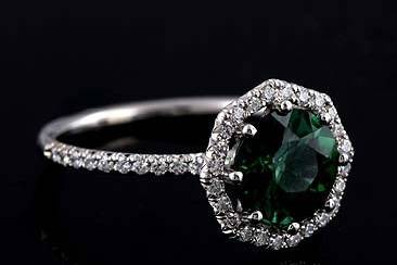 14K White Gold Cut Down Micro Pave Diamond Green Tourmaline Octagon Halo Engagement Ringhttp://www.orospot.com/product/r1098ven/14k-white-gold-cut-down-micro-pave-diamond-green-tourmaline-octagon-halo-engagement-ring.aspxSKU: R1098VEN$1,369.00This beautiful engagement ring is made of 14k white gold. Ring contains round cut, green tourmaline center stone (approx 1.73ct) securely set in eight prongs. There are diamonds (.34cttw, G-VS quality) cut down micro pave set all around center stone on the octagon shaped halo and half way on the shank. Height of the shank is 1.4 mm, ring is only 1.5 mm wide, the center stone is set above the finger 6 mm. Ring was designed to accommodate 7.9 mm center stone and is also available in variety of other gemstones. Please contact us if you are interested in any of these options. Please allow 2-3 wees to complete the order