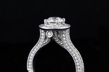 Designer Round Diamond Engagement Mounting Ring 18K White Goldhttp://www.orospot.com/product/r1001ven/designer-round-diamond-engagement-mounting-ring-18k-white-gold.aspxSKU: R1001VEN$1,999.0098 Diamonds Prong Set (.96cttw) Engagement Ring in 18K White Gold (Center Stone not Included) This Beautiful Mounting will Accommodate .75ct to 1.5 ct Center Stone. This Ring can be Purchased with or without Center Stone in all sizes, please contact us for more information.