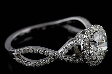 Diamond Pave Set Infinity Halo 14K White Gold Engagement Ring Mountinghttp://www.orospot.com/product/r1094ven/diamond-pave-set-infinity-halo-14k-white-gold-engagement-ring-mounting.aspxSKU: R1094VEN$2,099.00This unique diamond engagement ring mounting designed by Eternal is available in solid 14K Gold and 950 Platinum ($300 extra). Mounting contains small diamonds: micro pave cut down set all around center stone, 3/4 way on the split shank and under the center stone (0.52cttw, G-VS quality). The center stone is not included with this price (pictured with 1.5CT Diamond), but can be ordered separately. This classic ring mounting can be created for most shapes and sizes of the center stone. Center Stone: NOT Included. (This ring mounting can accommodate most shapes and sizes of the center stone. Please contact us for more information) Shank Width: 5mm at the top of the shank. 1.5mm at the bottom of the shank. Shank Height: 6.5mm at the center stone.