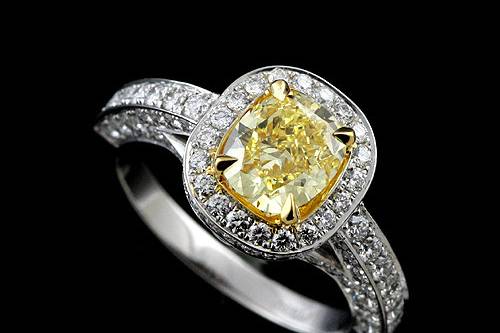 Modern Two Tone Platinum 18k Yellow Gold Pave Set Diamond Halo Engagement Ringhttp://www.orospot.com/product/r2032ven/modern-two-tone-platinum-18k-yellow-gold-pave-set-diamond-halo-engagement-ring.aspxSKU: R2032VEN$3,899.00This two tone (platinum and 18k yellow gold) ring was pictured with 1.5ct natural fancy yellow, cushion cut diamond. The center stone is not included with the price but can be ordered separately from our diamond inventory. Ring can be made to fit any shape/size of the center stone. There is over 100 diamonds, pave and two of them bezel set around the center stone, on the shank and on the bridge under the stone (approx 1.22 cttw, G-VS quality). Ring is 11 mm wide on the top (please note that the width depends of the size of the center stone), stone is set above the finger 7 mm. Shank is 2 mm wide and 1.8 mm tall on bottom. This outstanding, modern ring is available in all finger sizes, please allow 3-4 weeks to complete the order.
