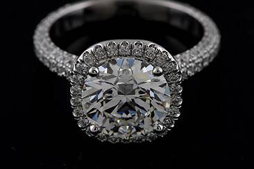 Round Forever Brilliant Moissanite Diamond Pave Set Halo Style Platinum Engagement Ringhttp://www.orospot.com/product/r1047venfb/round-forever-brilliant-moissanite-diamond-pave-set-halo-style-platinum-engagement-ring.aspxSKU: R1047VENFB$3,579.00This elegant engagement ring is platinum 950 pieces. Ring was designed by Eternal and contains round, forever brilliant moissanite 2ct (8 mm). There are small, round cut diamonds G-VS quality, .94cttw, 3/4 way on the shank and all around center stone. Ring is 2.6 mm wide and 7 mm tall and was created to exactly match our wedding band (SKU B1047VEN). Please allow 2-3 weeks to complete the order.