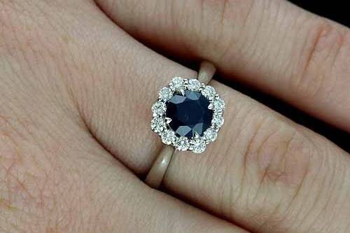 Round Blue Sapphire Diamond Cushion Shape Halo Modern Style Engagement Ring 14k White Goldhttp://www.orospot.com/product/r2041ven/round-blue-sapphire-diamond-cushion-shape-halo-modern-style-engagement-ring-14k-white-gold.aspxSKU: R2041VEN $819.00This beautiful halo style engagement ring is made of 14k white gold. Contains round, blue sapphire center stone (6 mm, approx 1ct.). There are diamonds (.26cttw, G-SI1 quality) prong set all around gemstone. Center stone is set above the finger 7 mm, shank is 1.3 mm tall and 2.3 mm wide, top of the ring is 9 mm in diameter. Ring was designed to accommodate 6 mm center stone and is also available in variety of other gemstones. Please contact us if you are interested in any of these options. Ring Weigh: 3.4g (in a size 6) Please allow 1-2 weeks to complete the order.