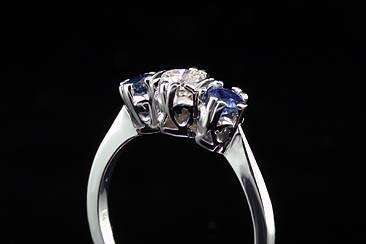 Vintage Inspired 14K White Gold 3 Stone Diamond Sapphire Engagement Ringhttp://www.orospot.com/product/a9680ma/vintage-inspired-14k-white-gold-3-stone-diamond-sapphire-engagement-ring.aspxSKU: A9680MA$930.00This vintage style 3 stone 14k white gold engagement ring has 3 round stones: 1 diamond- approx. .30Ct, H color and SI2 clarity and 2 blue round sapphires on the sides .40cttw. All three stones are set in prongs and half bezels. This ring can be ordered with any other combination of diamonds and color stones. Please contact us for more details.