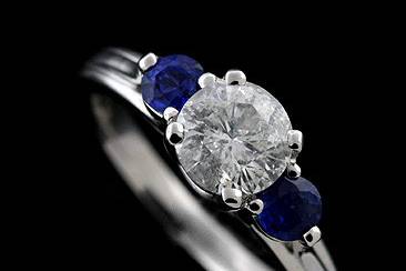 14K White Gold Diamond and Blue Sapphire Modern Style Engagement Ring Mountinghttp://www.orospot.com/product/rmh6/14k-white-gold-diamond-and-blue-sapphire-modern-style-engagement-ring-mounting.aspxSKU: RMH6$1,199.00This modern design engagement ring was pictured with two round sapphires (.51cttw) and one round brilliant diamond (1.23ct). The center stone is not included with the price, but can be ordered separately (please contact us for more information or browse our diamond inventory). Beautiful ring mounting is available in all sizes. please contact us for your size preference.