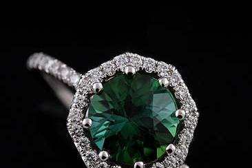 14K White Gold Cut Down Micro Pave Diamond Green Tourmaline Octagon Halo Engagement Ringhttp://www.orospot.com/product/r1098ven/14k-white-gold-cut-down-micro-pave-diamond-green-tourmaline-octagon-halo-engagement-ring.aspxSKU: R1098VEN$1,369.00This beautiful engagement ring is made of 14k white gold. Ring contains round cut, green tourmaline center stone (approx 1.73ct) securely set in eight prongs. There are diamonds (.34cttw, G-VS quality) cut down micro pave set all around center stone on the octagon shaped halo and half way on the shank. Height of the shank is 1.4 mm, ring is only 1.5 mm wide, the center stone is set above the finger 6 mm. Ring was designed to accommodate 7.9 mm center stone and is also available in variety of other gemstones. Please contact us if you are interested in any of these options. Please allow 2-3 wees to complete the order.