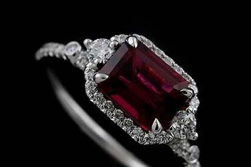 14K White Gold Diamond Emerald Cut Rubellite Halo Modern Engagement Ringhttp://www.orospot.com/product/r2005ven/14k-white-gold-diamond-emerald-cut-rubellite-halo-modern-engagement-ring.aspxSKU: R2005VEN$1,499.00This beautiful 14k gold engagement ring contains emerald cut rubellite center stone (1.62ct). Ring is securely, cut down micro pave set in diamonds all around center stone and half way on the shank. There are two small diamond bezel set on the shank and two of them, prong set from both sides of the center stone (.35cttw, G-VS quality). Height of the shank is 1.1 mm, ring is only 1.4 mm wide, the center stone is set above the finger 6.5 mm. Ring was designed to accommodate 7.7 mm x 6 mm emerald center stone and is also available in variety of other gemstones. This unique, modern style ring can be also made in platinum 950 (for additional $300). Please contact us if you are interested in any of these options. Please allow 2-3 wees to complete the order.