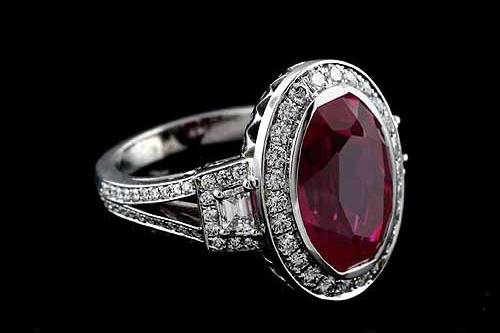 18K White Gold Oval Bezel Pink Tourmaline Pave Diamond Halo Engagement Ring Mounting Settinghttp://www.orospot.com/product/r2039ven/18k-white-gold-oval-bezel-pink-tourmaline-pave-diamond-halo-engagement-ring-mounting-setting.aspxSKU: R2039VEN $2,739.00This fancy engagement ring was designed by Eternal and is a 18k white gold pieces. Center stone and sides trapezoid diamonds are NOT included with the price, but can be ordered separately from our inventory. Pictured with 5ct (14 x 10) oval pink tourmaline and two sides diamonds trapezoid .30cttw. Ring can be create to accommodate any shape/size of the center stone. Mounting contains round diamonds, micro pave set around center stone (.38ct, G-VS quality), 3/4 way on the split shank (.33ct, G-VS quality) and around sides trapezoid stones (.14cttw, G-VS quality). Top of the ring is 19.5 mm x 15 mm, please note that the width depend on the size of the center stone. Bottom shank is 3 mm wide and 1.5 mm tall.