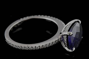 FINAL SALE SALE 35% off Cushion Iolite Diamond Cut Down Micropave Platinum Engagement Ringhttp://www.orospot.com/product/r1092ven/final-sale-sale-35-off-cushion-iolite-diamond-cut-down-micropave-platinum-engagement-ring.aspxSKU: R1092VEN$1,119.00This modern style engagement ring is made of platinum 950. Center Iolite, cushion shape stone is approx. 2.30ct (10 x 8 mm). Ring contains cut down micro pave set diamonds on both sides of the shank (.29ct) and pave set diamonds under the center stone (.09ct). Shank is 1.7mm wide, 1.7mm tall on the bottom and 2.5mm tall at the top. Center stone is set above the finger approx. 5mm. This beautiful gemstone ring is available in sizes from 5 to 7.