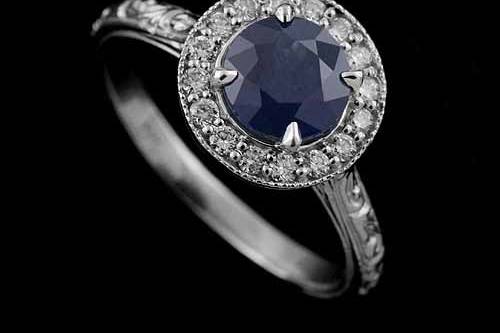 Diamond Round Blue Sapphire Engraved Vintage Style Halo Engagement Ringhttp://www.orospot.com/product/r1071vens/diamond-round-blue-sapphire-engraved-vintage-style-halo-engagement-ring.aspxSKU: R1071VENS$769.00This beautiful halo engagement ring is made of 14k white gold. Ring contains round cut, blue sapphire center stone (6mm, approx 1ctww.) and small diamonds, (.16cttw, G-SI1 quality) prong set all around. Engraved shank is 1.8mm wide and 1.4mm tall. Vintage style ring is available in sizes from 4 to 8, please contact us for more information. This style is also available in a variety of other gems such as: Citrine, Blue Topaz, Amethyst, Garnet and Peridot. Please contact us if you are interested in any of these options. Please allow 2-3 weeks to complete the order