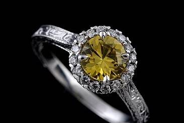 Diamond Round Yellow Sapphire Engraved Vintage Style Engagement Ringhttp://www.orospot.com/product/r1070ven/diamond-round-yellow-sapphire-engraved-vintage-style-engagement-ring.aspxSKU: R1070VEN $899.00This beautiful halo engagement ring is made of 14k white gold. Ring contains round cut, yellow sapphire center stone (approx. 1ct.), diamonds (.16cttw, G-SI1 quality) 