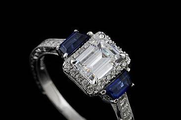 Hand Engraved Diamond Trapezoid Sapphire Vintage Style 14k White Gold Engagement Ring Mountinghttp://www.orospot.com/product/r1072ven/hand-engraved-diamond-trapezoid-sapphire-vintage-style-14k-white-gold-engagement-ring-mounting.aspxSKU: R1072VEN$2,399.00This fancy diamond engagement ring mounting is made 14k white gold. Center stone is not included with the price, but can be ordered separately from our diamond inventory (pictured with approx. 1ct emerald center stone). Mounting contains two sides sapphire trapezoid .50cttw, diamonds, micro pave cut down set around center stone (.17ct, G-VS quality) and pave set on shank from both sides (.16ct, G-VS quality). Whole ring is beautifully hand engraved (not casted or computer generated) and miligrained on the edges. The quality of this vintage style ring is outstanding. Elegant engagement ring can be ordered in all finger sizes, please contact us for more information. Please allow 2-3 weeks to complete the order.