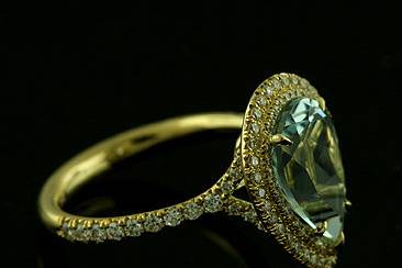 Pear Shape Aquamarine Diamond Cut Down Micro Pave 18k Yellow Gold Engagement Ringhttp://www.orospot.com/product/r1090ven/pear-shape-aquamarine-diamond-cut-down-micro-pave-18k-yellow-gold-engagement-ring.aspxSKU: R1090VEN$2,549.00This elegant double halo style engagement ring is made of solid 18K yellow gold. Ring contains round cut diamonds, half way on the shank, cut down micro pave set from the biggest to the smaller one (approx. .25cttw, G-VS quality), and two rows of diamonds all around center stone (.45ctt, G-VS quality). Pear shape aquamarine center stone is approx 2ct. Width of the shank is approx. 2.5mm, height 2mm. Ring is available also in 18k white gold and can be ordered in all finger sizes, please contact us for your size preference. Please allow 2-3 weeks to complete the order.