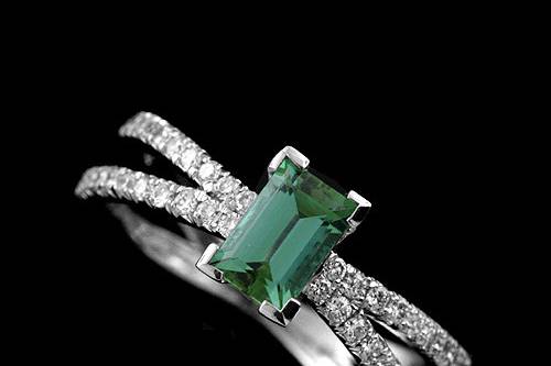 Platinum Cut Down Micro Pave Split Shank Diamond Green Tourmaline Engagement Ringhttp://www.orospot.com/product/r2030ven/platinum-cut-down-micro-pave-split-shank-diamond-green-tourmaline-engagement-ring.aspxSKU: R2030VEN$1,739.00This exquisite platinum engagement ring contains 6 x 4 mm baguette green tourmaline .64cttw. There are 40 diamonds, cut down micro pave set on the split shank (.40Ct, G-VS quality). Shank is 1.3 mm tall and 5 mm wide on the split shank part. Center stone is set approx. 4.5 mm above the finger.