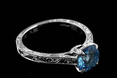 Platinum 950 Hand Engraved Vintage Style Cushion Shape Blue Topaz Engagement Ringhttp://www.orospot.com/product/r2028vent/platinum-950-hand-engraved-vintage-style-cushion-shape-blue-topaz-engagement-ring.aspxSKU: R2028VENT$1,249.00This platinum ring contains 6.5 mm cushion shape blue topaz. Whole ring is beautifully hand engraved and milgrain on the edges. Width of the shank is 2 mm. Ring is available in sizes from 4 to 8, please allow 2-3 weeks to complete the order.