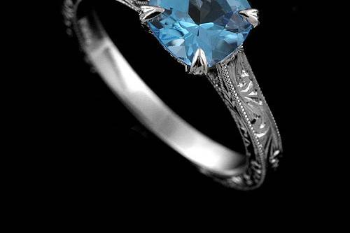 Platinum 950 Hand Engraved Vintage Style Cushion Shape Blue Topaz Engagement Ringhttp://www.orospot.com/product/r2028vent/platinum-950-hand-engraved-vintage-style-cushion-shape-blue-topaz-engagement-ring.aspxSKU: R2028VENT$1,249.00This platinum ring contains 6.5 mm cushion shape blue topaz. Whole ring is beautifully hand engraved and milgrain on the edges. Width of the shank is 2 mm. Ring is available in sizes from 4 to 8, please allow 2-3 weeks to complete the order.