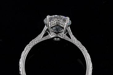 2CT Forever Brilliant Moissanite Vintage Style Engraved Solitaire Solid 14K Gold Engagement Ringhttp://www.orospot.com/product/r1087venm/2ct-forever-brilliant-moissanite-vintage-style-engraved-solitaire-solid-14k-gold-engagement-ring.aspxSKU: R1087VENM $1,099.00Vintage style engagement ring is made of solid 14k white gold. Contains 2CT Round Shape Forever Brilliant Moissanite set in 