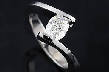 Cushion Diamond Engagement Ring 14K White Gold Mountinghttp://www.orospot.com/product/r1014ven/cushion-diamond-engagement-ring-14k-white-gold-mounting.aspxSKU: R1014VEN $799.00This unique mounting is made of 14k white gold. Center stone not included (Pictured Center Stone Approx. 1Ct). This ring can be created to fit any center stone shape. For more information please contact us.