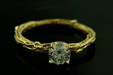 Organic Design Vintage Style Diamond 18K Yellow Gold Engagement Ringhttp://www.orospot.com/product/r1060ven/organic-design-vintage-style-diamond-18k-yellow-gold-engagement-ring.aspxSKU: R1060VEN$1,999.00Organic, design ring is made of solid 18k yellow gold. This one of a kind ring contains round cut diamond approx. 0.60ct, G-H color and SI1-SI2 clarity. Beautifully engraved shank (2.5mm wide, 1.9mm tall) with leaves accent makes this ring original and unique. Vintage style engagement ring is also available in white/pink gold and platinum (for additional $250). A matching wedding band in solid 18K gold is available for $339. This classic beauty can be ordered in all finger sizes, please contact us for your size preference. Please allow 2-3 weeks to complete the order.