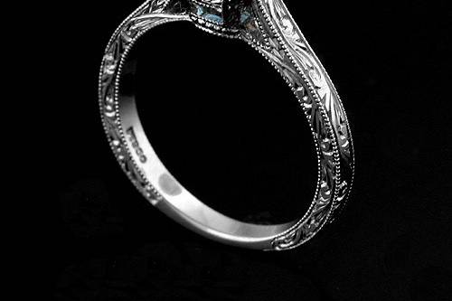 Platinum 950 Hand Engraved Vintage Style Cushion Shape Blue Topaz Engagement Ringhttp://www.orospot.com/product/r2028vent/platinum-950-hand-engraved-vintage-style-cushion-shape-blue-topaz-engagement-ring.aspxSKU: R2028VENT$1,249.00This platinum ring contains 6.5 mm cushion shape blue topaz. Whole ring is beautifully hand engraved and milgrain on the edges. Width of the shank is 2 mm. Ring is available in sizes from 4 to 8, please allow 2-3 weeks to complete the order.