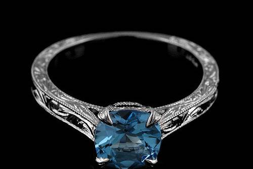 Platinum 950 Hand Engraved Vintage Style Cushion Shape Blue Topaz Engagement Ringhttp://www.orospot.com/product/r2028vent/platinum-950-hand-engraved-vintage-style-cushion-shape-blue-topaz-engagement-ring.aspxSKU: R2028VENT$1,249.00This platinum ring contains 6.5 mm cushion shape blue topaz. Whole ring is beautifully hand engraved and milgrain on the edges. Width of the shank is 2 mm. Ring is available in sizes from 4 to 8, please allow 2-3 weeks to complete the order.