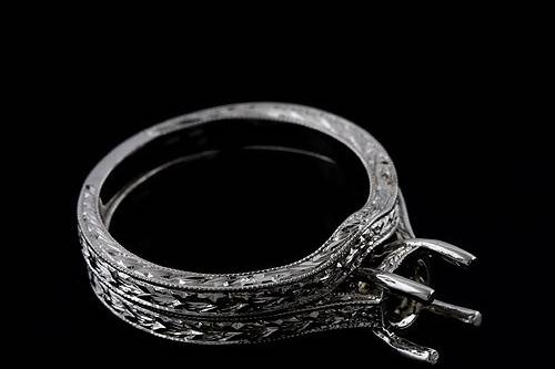14k White Gold Engraved Vintage Antique Reproduction Ring Setting Mountinghttp://www.orospot.com/product/r2031ven/14k-white-gold-engraved-vintage-antique-reproduction-ring-setting-mounting.aspxSKU: R2031VEN$399.00This 14k gold ring was created to accommodate round center stone from 5.5 to 6mm but can designed to fit any shape/size of the center stone. If you are interested in this mounting and have your own center stone, please contact us and provide the stone shape and measurements, we will create this ring just for your stone for additional $300. Whole ring is beautifully engraved and milgrain on the edges. Width of the shank is 2 mm, height approx 1.9 mm on the thickest part. Pictured matching wedding band is not included with the price but is available for additional $269