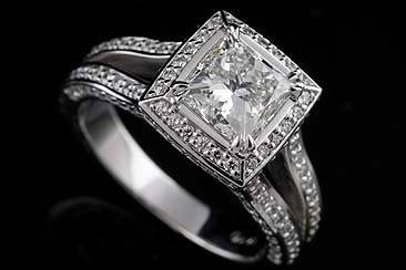 GIA Certified Princess Cut 3cttw Diamond Engagement Ring 18K White Goldhttp://www.orospot.com/product/r1017ven/gia-certified-princess-cut-3cttw-diamond-engagement-ring-18k-white-gold.aspxSKU: R1017VEN$18,450.00Diamond princess cut engagement ring is made of 18K white gold and contains pin-point, round cut diamonds (G-VS1 quality, .96cttw). Center Stone Information: LAB: GIA Carat Weight : 2.10 ct Color: I Clarity: VS2 Polish: Excellent Symmetry: Very Good Fluorescence: None Ring is available in all sizes for more information please contact us.