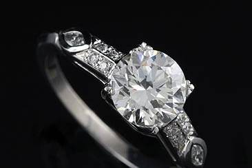 Antique 1.43Ct Diamond Platinum Engagement Ringhttp://www.orospot.com/product/rppd67mh/antique-1-43ct-diamond-platinum-engagement-ring.aspxSKU: RPPD67MH $6,499.00This beautiful antique style engagement ring is made of platinum 950. Contains round cut, GIA certified diamond center stone ( 1.27Ct J color and VS2 clarity) and small round cut diamonds on the shank ( approx . 16cttw). This ring is available in all sizes, please contact us for more information.