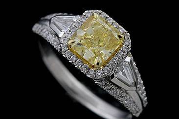 2.06 Cttw Fancy Intense Yellow Natural Diamond Platinum / 18K Yellow Gold Engagement Ringhttp://www.orospot.com/product/rtpyymh/2-06-cttw-fancy-intense-yellow-natural-diamond-platinum-18k-yellow-gold-engagement-ring.aspxSKU: RTPYYMH$12,999.00This Elegant, modern design, engagement ring contains one intense yellow radiant cut diamond (1.11Ct ), two special cut side diamonds (G color and VS Clarity and .40Cttw) and .55Ct of micro pave set diamonds. (G color and VS1 Clarity) The quality of this ring is outstanding. This ring is available in all sizes, please contact us for you size preference.