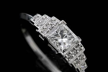 18K White Gold Princess Cut Antique Style Diamond Engagement Ringhttp://www.orospot.com/product/rbuyymh/18k-white-gold-princess-cut-antique-style-diamond-engagement-ring.aspxSKU: RBUYYMH$2,399.00This vintage style engagement ring is made of 18K white gold. Contains princess cut diamond center stone (.52cttw, G color and VS1 clarity) and twelve round cut, small diamonds from both sides (.10cttw) This beautiful diamond ring is available in all sizes, please contact us for your size preference and for more information.