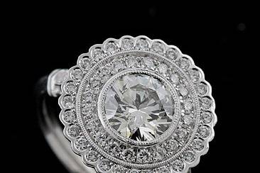 GIA Diamond Halo Flower Antique Style Platinum Micro Pave Platinum Engagement Ringhttp://www.orospot.com/product/r1074ven/gia-diamond-halo-flower-antique-style-platinum-micro-pave-platinum-engagement-ring.aspxSKU: R1074VEN$4,199.00This exquisite platinum engagement ring contains round center diamond (minimum .50ct, G-SI1 quality, GIA certified). The stone is surrounded by micro pave and burnish set diamonds and there are 6 diamonds micro set on the leaf ended shank (Total diamond weight is approx. .40cttw G-VS quality). The top is approx 12mm wide in diameter and 5.5mm tall, but may change if smaller or lager center stone is used. This ring can be ordered with any size of round center stone. Please contact us for more information. Please allow at least 3 to 4 weeks to complete the order.