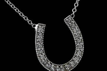 Diamond Lucky Horseshoe 14K White Gold Pendant Necklacehttp://www.orospot.com/product/p1307wpp/diamond-lucky-horseshoe-14k-white-gold-pendant-necklace.aspxSKU: P1307WPP$439.00Horseshoe is widely known symbol of good luck. Designer diamond horseshoe is made of 14k white gold and is 16mm tall (6/10inch) 13mm (5/10inch) wide. Pendant comes with 14K white gold chain (16 or 18 inch length, weights approx 1.1g), weights 1.4g (without chain). Necklace contains round cut diamonds and one princess cut diamond .24cttw, SI1 – SI2 clarity, G-H. This gold pendant was designed and created by P&P luxury and is also available in yellow and pink gold.