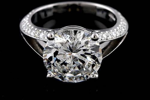 .06ct Diamonds Edwardian Style Engagement Ring Setting Mounting With Hand Engravinghttp://www.orospot.com/product/r2046ven/06ct-diamonds-edwardian-style-engagement-ring-setting-mounting-with-hand-engraving.aspxSKU: R2046VEN $1,479.00Setting was created to accommodate 5 mm round center stone. Ring is a platinum pieces and contains .06ct, pave set diamonds on the leaves accents form both sides of the center stone. To achieve the highest quality ring is hand engraved and milgrain. Shank is 1.8 mm wide on the bottom, 2.1 mm wide at the top (engraving section). Height of the shank is 1.5 mm on the bottom and 2.2 mm at the engraved part. Center stone will be set above the finger approx 6 mm. Please allow 2-3 weeks to complete the order.