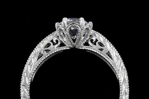 Vintage Style Reproduction Pave Set Diamonds And 6 mm White Sapphire Engraved Engagement Ringhttp://www.orospot.com/product/r2050ven/vintage-style-reproduction-pave-set-diamonds-and-6-mm-white-sapphire-engraved-engagement-ring.aspxSKU:R2050VEN $799.00Ring is available in sizes form 4 to 8, please allow 2 weeks to complete the order.