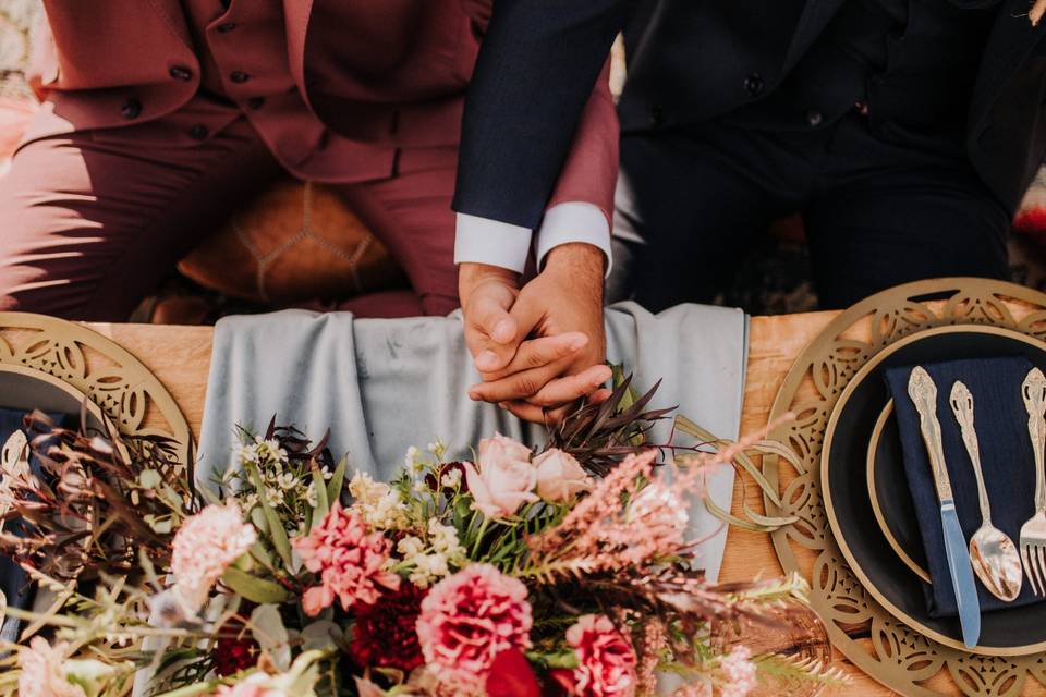 Grooms holding hands