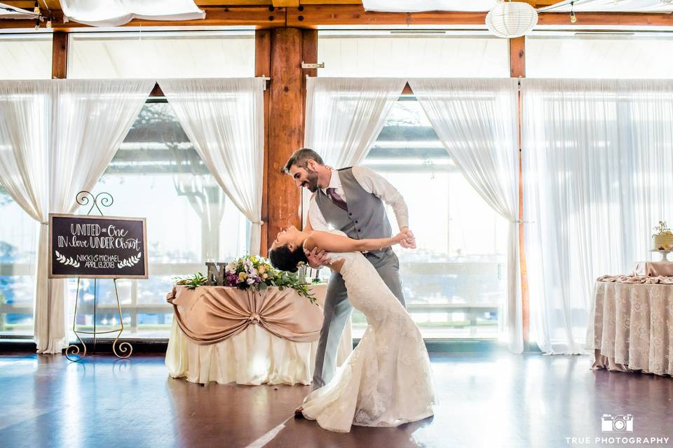 Groom dips his bride