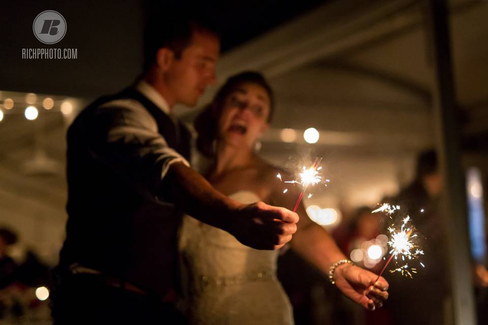 Newlyweds with sparklers