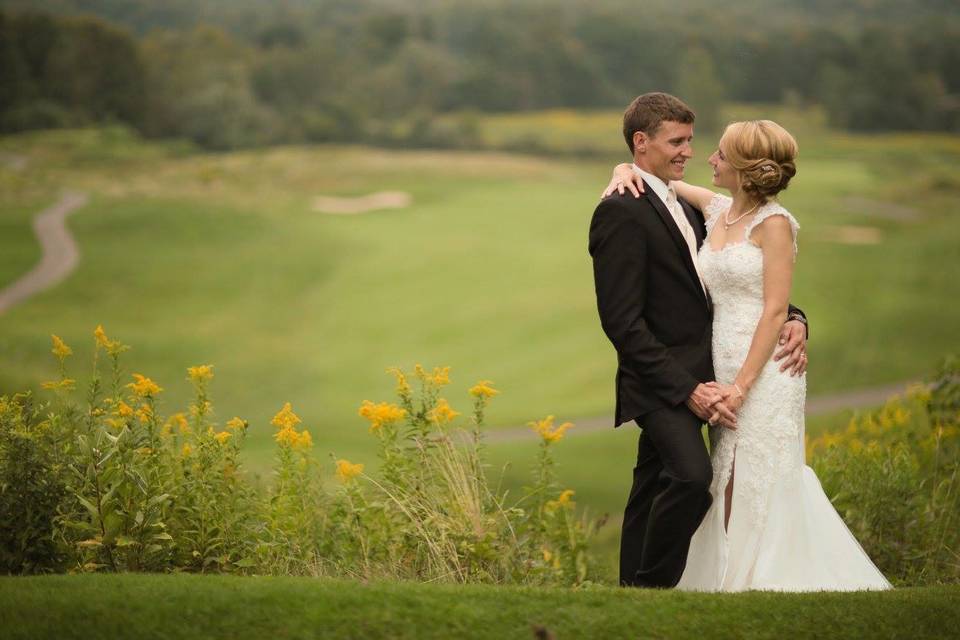 Bride and groom in the field