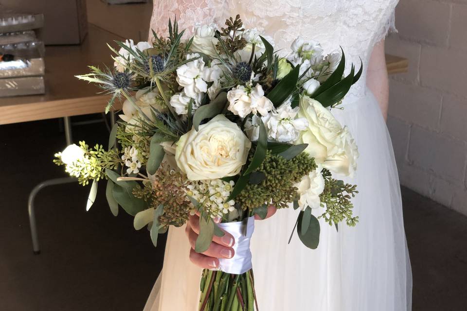 Hand tied bouquet with Garden roses, lisianthus, ranunculus, stock, wax flower and eucalyptus,